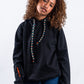 HOODIE NEGRO UNISEX SANARA MAÑANA - CONFIANZA